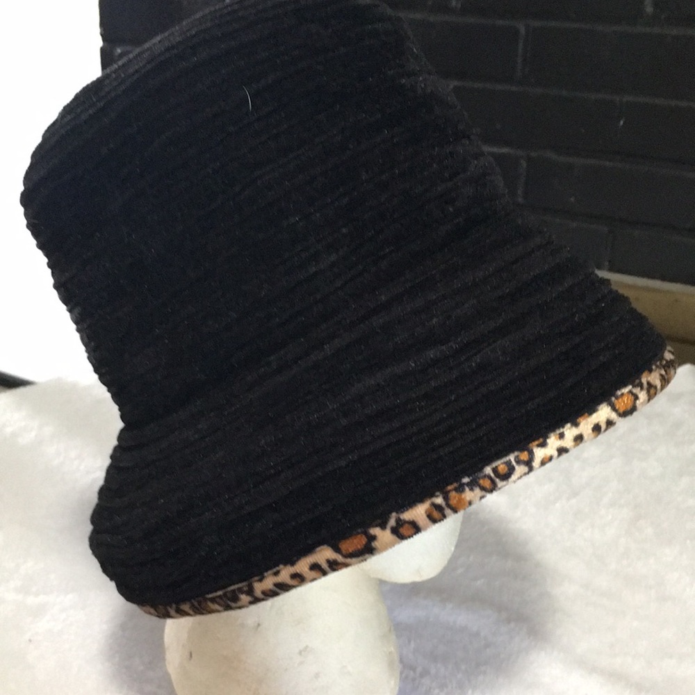 Black ribbed bucket hat with leopard print trim around bottom edge